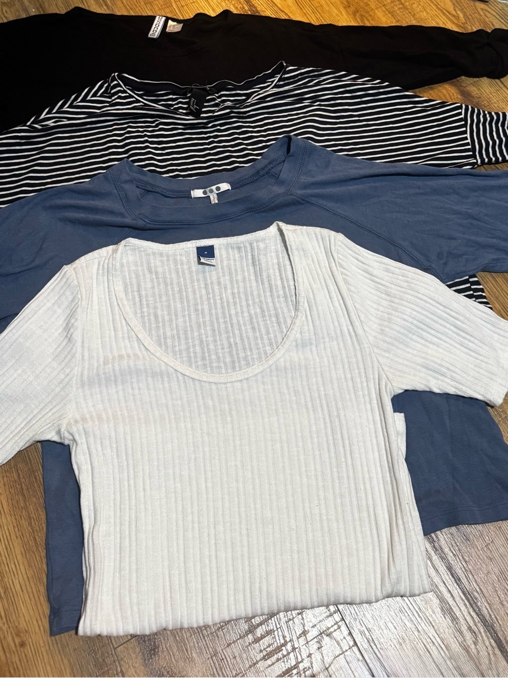 Four 3/4 sleeve shirts: black, striped, white and blue